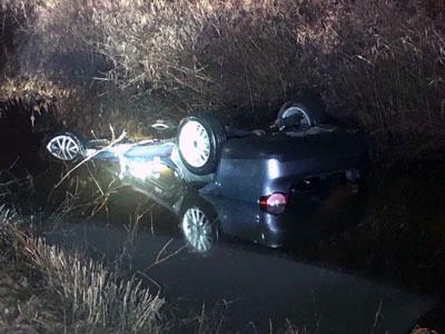 Woman trapped in submerged vehicle